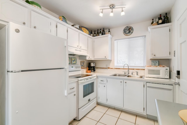 4 Garden St Unit 204N, Tequesta, FL 33469 - kitchen featuring white appliances, a sink, under cabinet range hood, light countertops, and white cabinetry