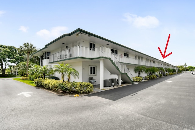 4 Garden St Unit 204N, Tequesta, FL 33469 - view of property featuring stairs and central AC unit