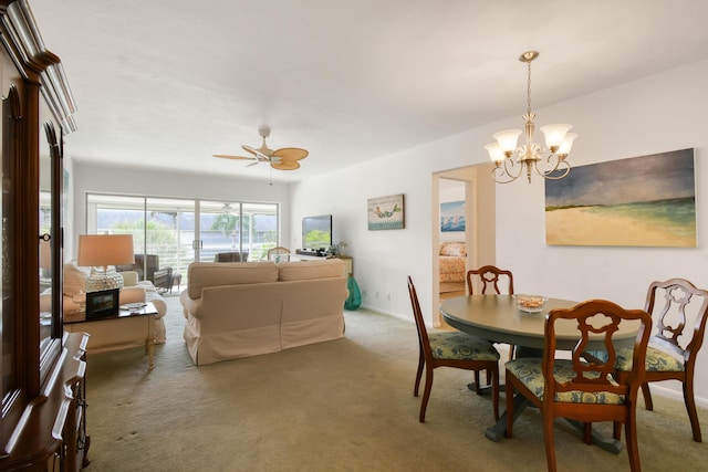 4 Garden St Unit 204N, Tequesta, FL 33469 - carpeted dining area featuring a chandelier, a ceiling fan, and baseboards