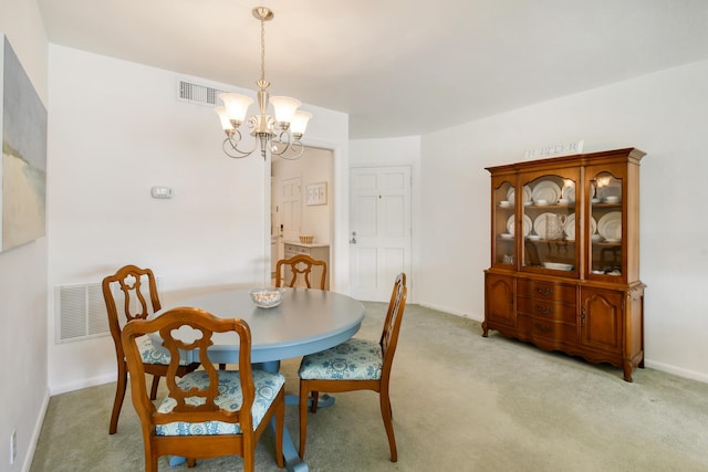 4 Garden St Unit 204N, Tequesta, FL 33469 - dining area with a chandelier, light carpet, and baseboards
