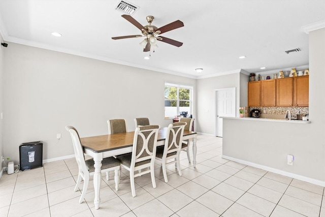 2481 SE Berkshire Blvd, Port Saint Lucie, FL 34952 - dining area with ceiling fan, ornamental molding, light tile patterned flooring, recessed lighting, and baseboards
