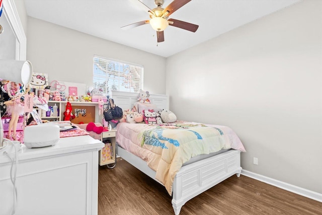 2481 SE Berkshire Blvd, Port Saint Lucie, FL 34952 - bedroom featuring wood finished floors, baseboards, and a ceiling fan