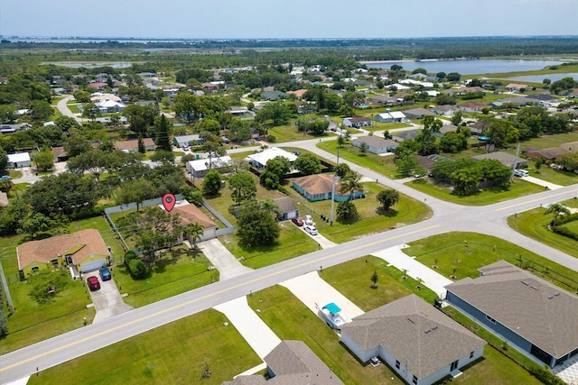 2481 SE Berkshire Blvd, Port Saint Lucie, FL 34952 - aerial perspective of suburban area with a large body of water