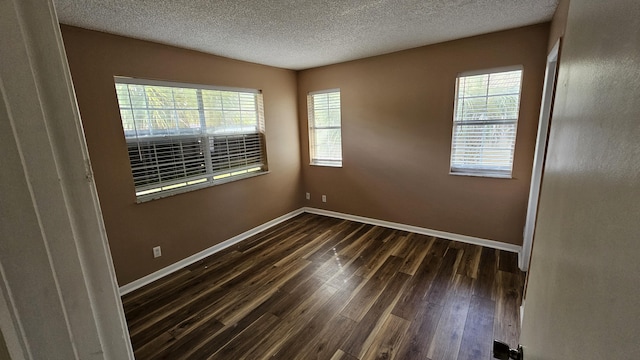 11474 NW 42nd St Unit 11474, Coral Springs, FL 33065 - unfurnished room with dark wood-style flooring, a textured ceiling, and baseboards