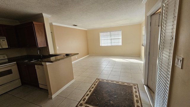 11474 NW 42nd St Unit 11474, Coral Springs, FL 33065 - kitchen with white appliances, crown molding, light tile patterned floors, a sink, and a peninsula