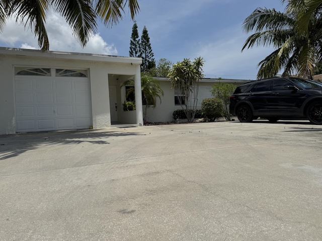 4607 Sutton Ter S, West Palm Beach, FL 33415 - view of front of property featuring stucco siding and driveway