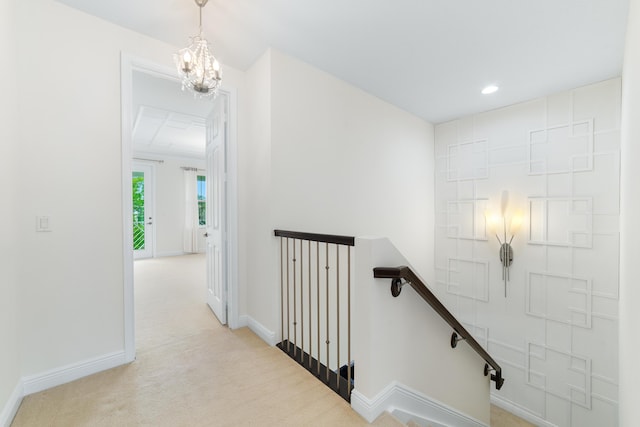 3040 Princeton Ln, Palm Beach Gardens, FL 33418 - hall with an upstairs landing, a chandelier, light colored carpet, baseboards, and recessed lighting