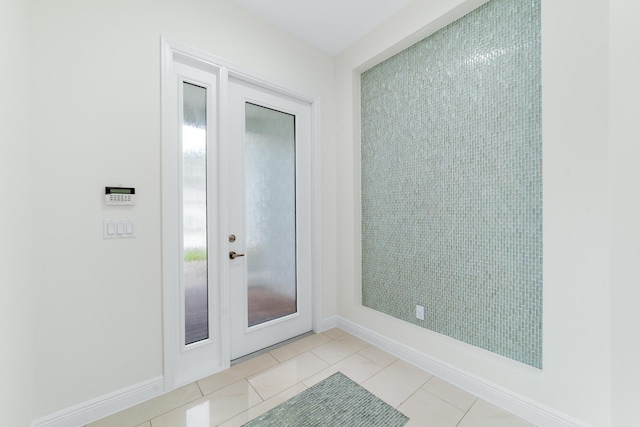 3040 Princeton Ln, Palm Beach Gardens, FL 33418 - entryway featuring baseboards and light tile patterned floors