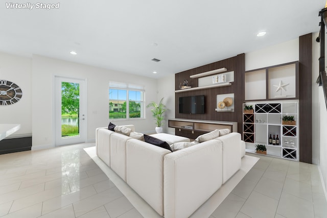 3040 Princeton Ln, Palm Beach Gardens, FL 33418 - living room with recessed lighting, light tile patterned floors, and baseboards