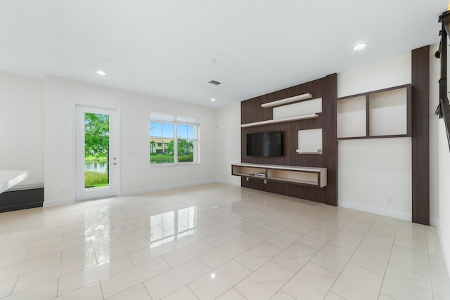 3040 Princeton Ln, Palm Beach Gardens, FL 33418 - unfurnished living room featuring baseboards, recessed lighting, and light tile patterned floors