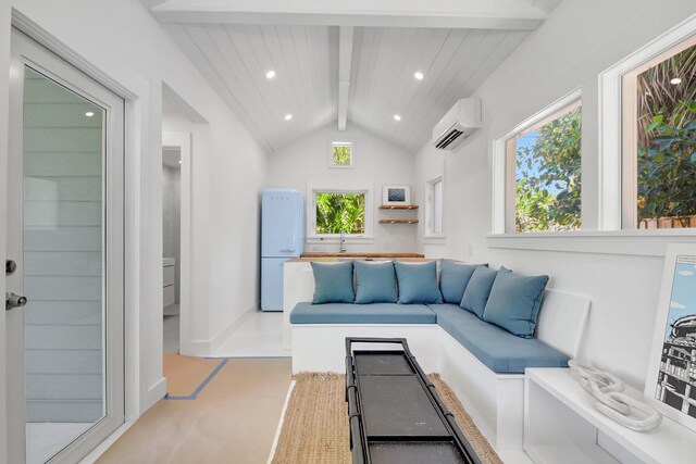 220 S L St, Lake Worth Beach, FL 33460 - living area with a wall mounted air conditioner, recessed lighting, and baseboards