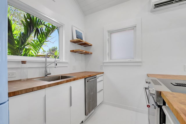 220 S L St, Lake Worth Beach, FL 33460 - kitchen with butcher block counters, a sink, white cabinets, appliances with stainless steel finishes, and open shelves