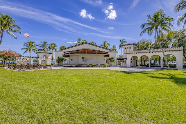220 S L St, Lake Worth Beach, FL 33460 - back of property with a lawn, stucco siding, and a gazebo