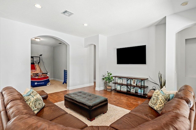 8940 New Hope Ct, West Palm Beach, FL 33411 - living area with arched walkways, wood finished floors, recessed lighting, and baseboards