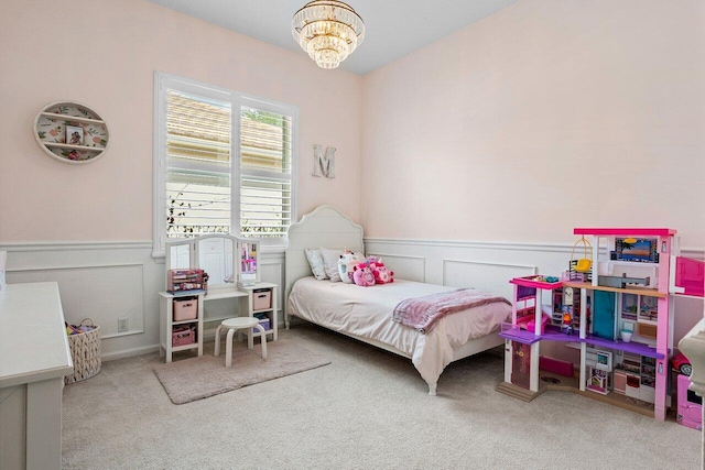 8940 New Hope Ct, West Palm Beach, FL 33411 - carpeted bedroom with a chandelier, a wainscoted wall, and a decorative wall