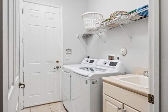 8940 New Hope Ct, West Palm Beach, FL 33411 - laundry area with washer and dryer, cabinet space, and light tile patterned flooring