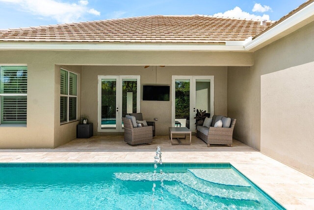8940 New Hope Ct, West Palm Beach, FL 33411 - outdoor pool with french doors, a patio area, and outdoor lounge area