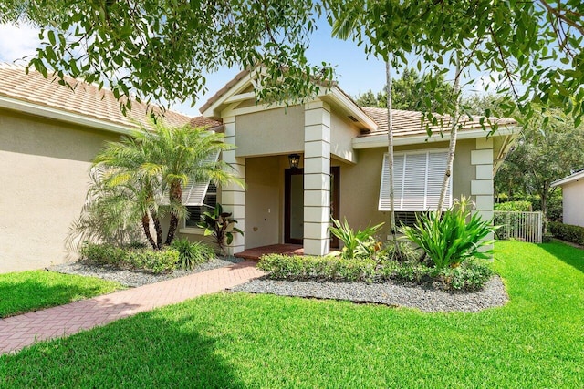 8940 New Hope Ct, West Palm Beach, FL 33411 - view of front of house with stucco siding and a tile roof