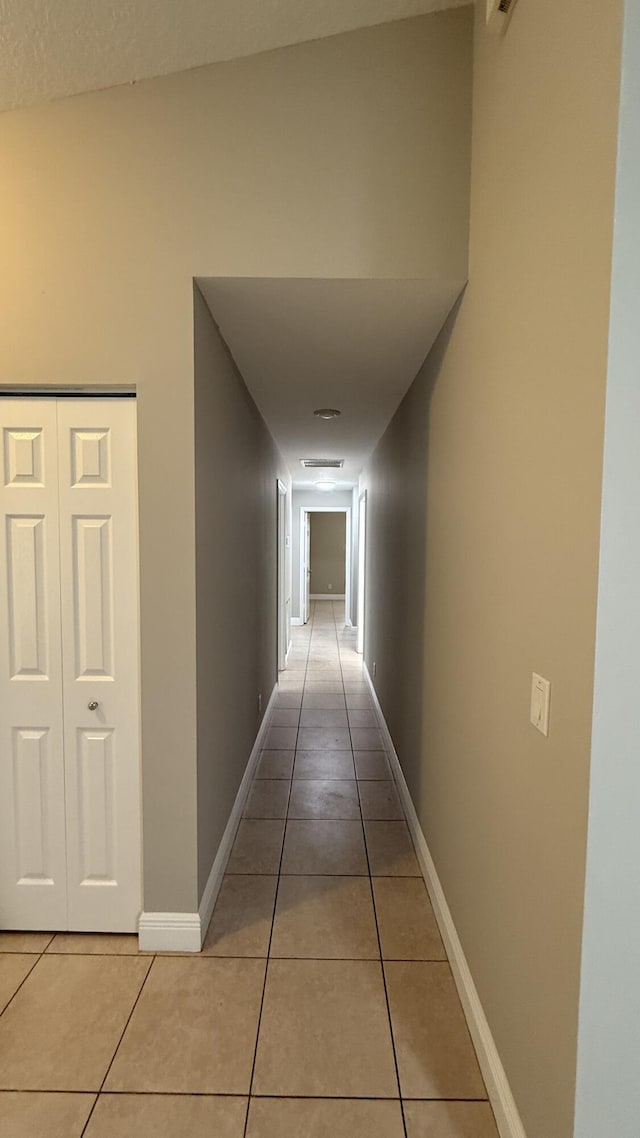 2134 SW Savage Blvd, Port Saint Lucie, FL 34953 - hallway featuring light tile patterned floors and baseboards