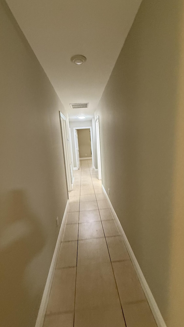 2134 SW Savage Blvd, Port Saint Lucie, FL 34953 - hall featuring light tile patterned floors and baseboards