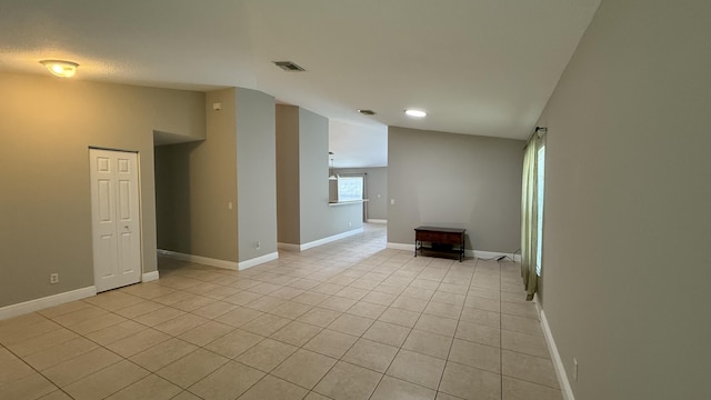 2134 SW Savage Blvd, Port Saint Lucie, FL 34953 - empty room featuring lofted ceiling, light tile patterned floors, baseboards, and recessed lighting