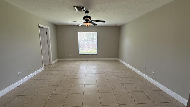 2134 SW Savage Blvd, Port Saint Lucie, FL 34953 - unfurnished room featuring a textured ceiling, ceiling fan, light tile patterned flooring, and baseboards