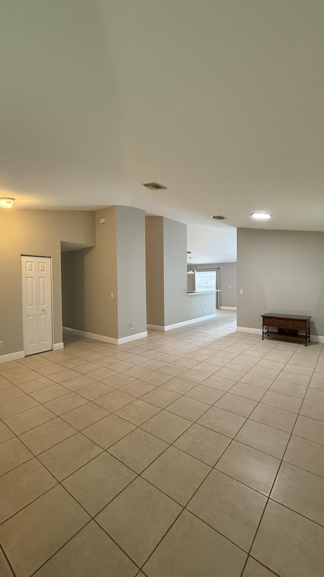 2134 SW Savage Blvd, Port Saint Lucie, FL 34953 - spare room featuring light tile patterned floors and baseboards