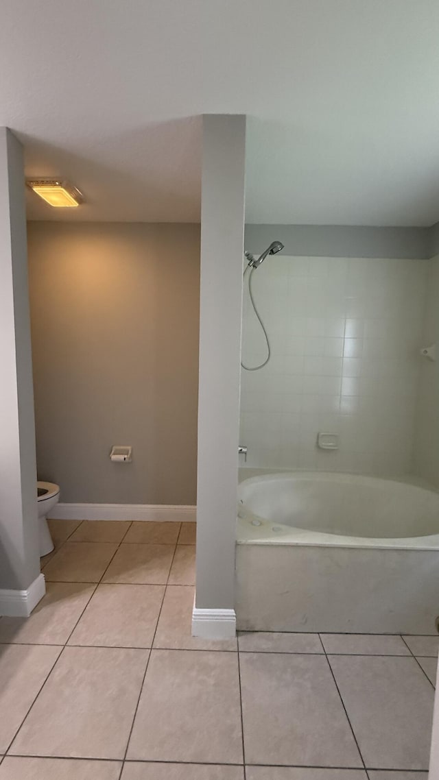 2134 SW Savage Blvd, Port Saint Lucie, FL 34953 - full bathroom with tile patterned flooring, toilet, shower / tub combination, and baseboards