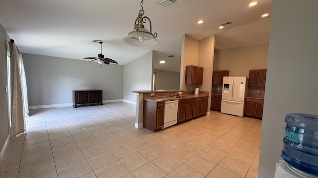 2134 SW Savage Blvd, Port Saint Lucie, FL 34953 - kitchen featuring white appliances, lofted ceiling, light tile patterned floors, a sink, and open floor plan