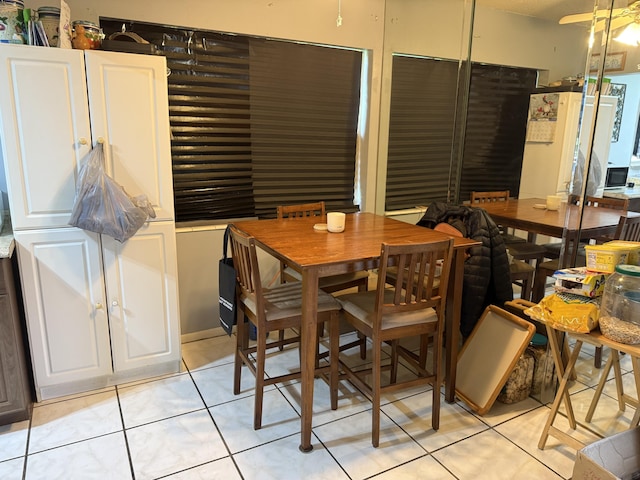 37 Waltham Unit B, West Palm Beach, FL 33417 - dining room featuring light tile patterned flooring