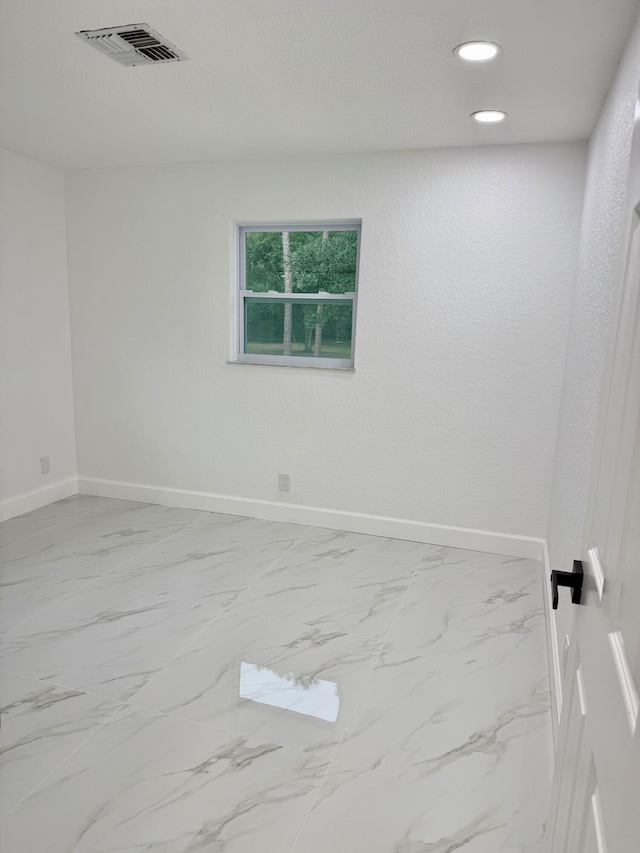 2812 F Rd, Loxahatchee Groves, FL 33470 - spare room with baseboards, marble look tiles, and recessed lighting