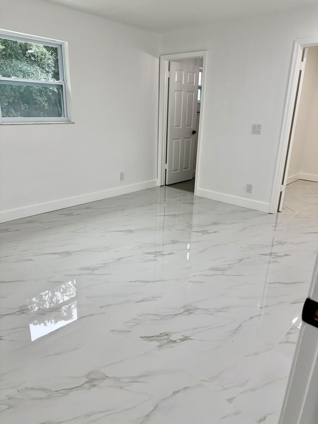 2812 F Rd, Loxahatchee Groves, FL 33470 - empty room with light marble finish floors and baseboards