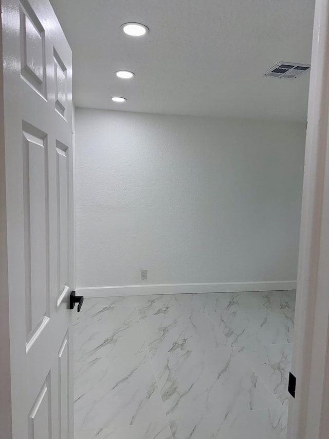 2812 F Rd, Loxahatchee Groves, FL 33470 - unfurnished room featuring baseboards, recessed lighting, and marble look tiles