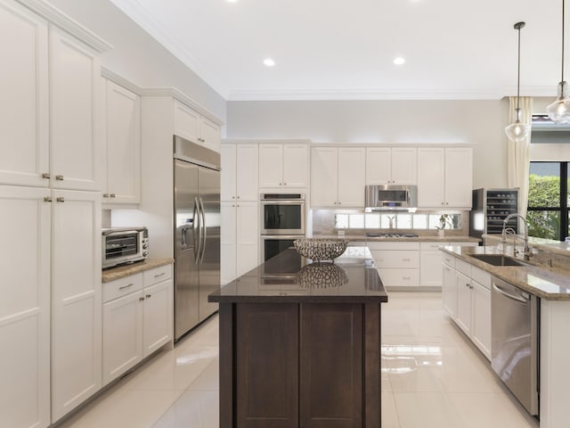 8784 Lewis River Rd, Delray Beach, FL 33446 - kitchen featuring stainless steel appliances, a center island with sink, a sink, light tile patterned flooring, and crown molding