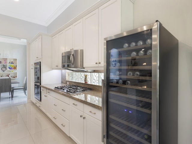 8784 Lewis River Rd, Delray Beach, FL 33446 - kitchen featuring wine cooler, appliances with stainless steel finishes, ornamental molding, light tile patterned flooring, and light stone counters