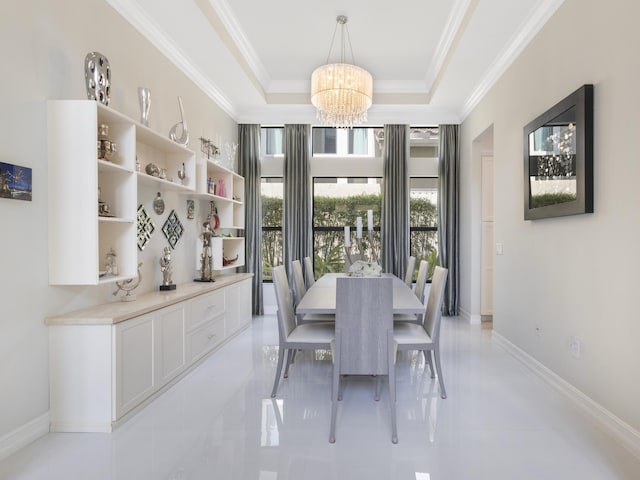8784 Lewis River Rd, Delray Beach, FL 33446 - dining room with a chandelier, ornamental molding, light tile patterned floors, a tray ceiling, and baseboards