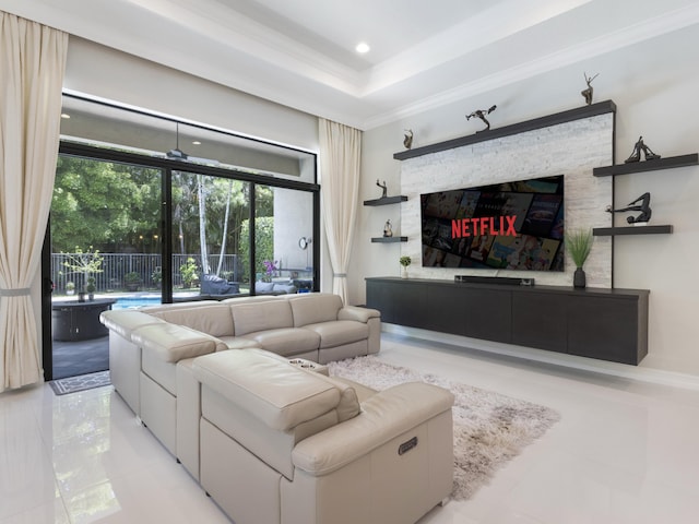 8784 Lewis River Rd, Delray Beach, FL 33446 - living room with crown molding, recessed lighting, a tray ceiling, and a stone fireplace