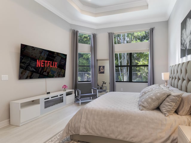 8784 Lewis River Rd, Delray Beach, FL 33446 - bedroom featuring wood finished floors, crown molding, and a tray ceiling