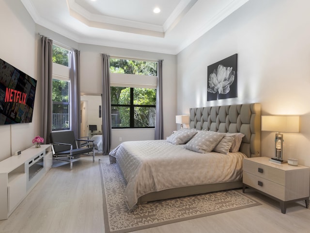 8784 Lewis River Rd, Delray Beach, FL 33446 - bedroom with light wood-style flooring, a tray ceiling, and ornamental molding