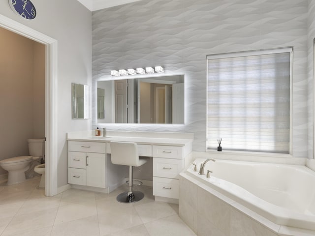8784 Lewis River Rd, Delray Beach, FL 33446 - bathroom featuring a bath, toilet, vanity, tile patterned flooring, and a bidet