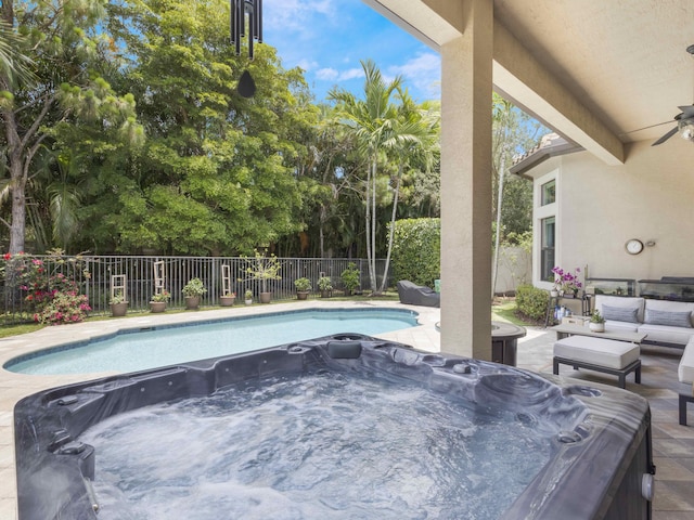 8784 Lewis River Rd, Delray Beach, FL 33446 - view of swimming pool with a hot tub, a fenced backyard, ceiling fan, and an outdoor living space