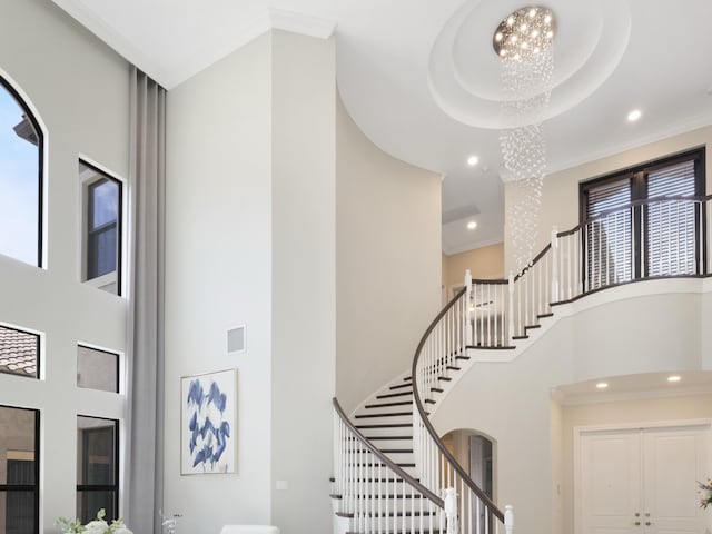 8784 Lewis River Rd, Delray Beach, FL 33446 - stairs with a towering ceiling, a chandelier, crown molding, and recessed lighting