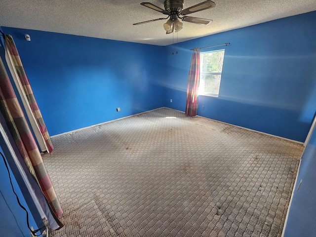 389 SE Tranquilla Ave, Port Saint Lucie, FL 34983 - unfurnished room with a ceiling fan, carpet flooring, a textured ceiling, and baseboards