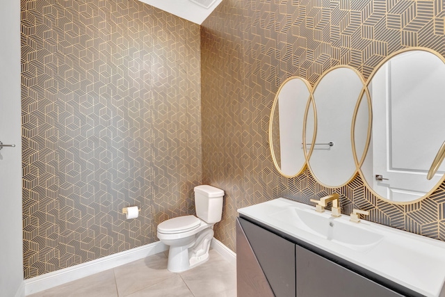 8660 W Parkland Bay Trl, Parkland, FL 33076 - bathroom featuring toilet, vanity, baseboards, tile patterned floors, and wallpapered walls