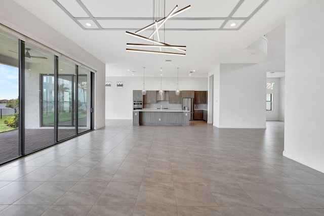 8660 W Parkland Bay Trl, Parkland, FL 33076 - unfurnished living room with recessed lighting and baseboards