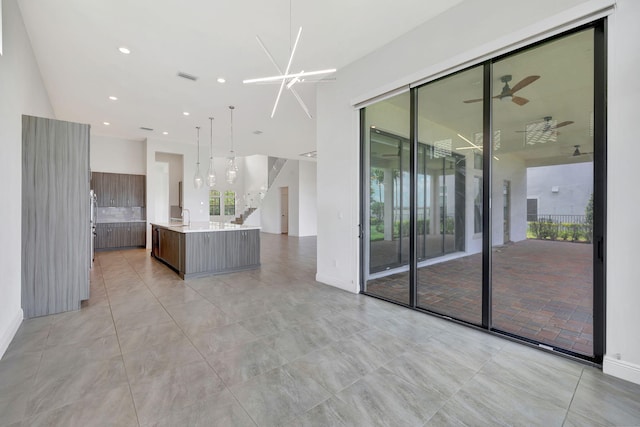 8660 W Parkland Bay Trl, Parkland, FL 33076 - spare room featuring a ceiling fan, plenty of natural light, recessed lighting, and baseboards