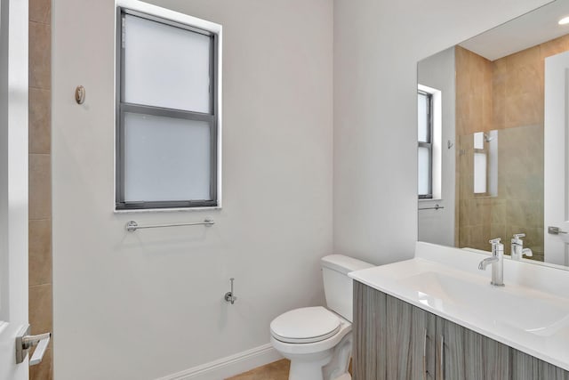 8660 W Parkland Bay Trl, Parkland, FL 33076 - bathroom featuring toilet, vanity, and baseboards