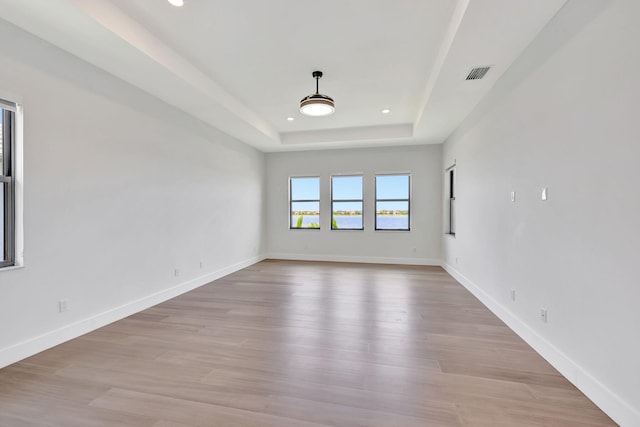8660 W Parkland Bay Trl, Parkland, FL 33076 - unfurnished room with recessed lighting, a raised ceiling, light wood-style flooring, and baseboards