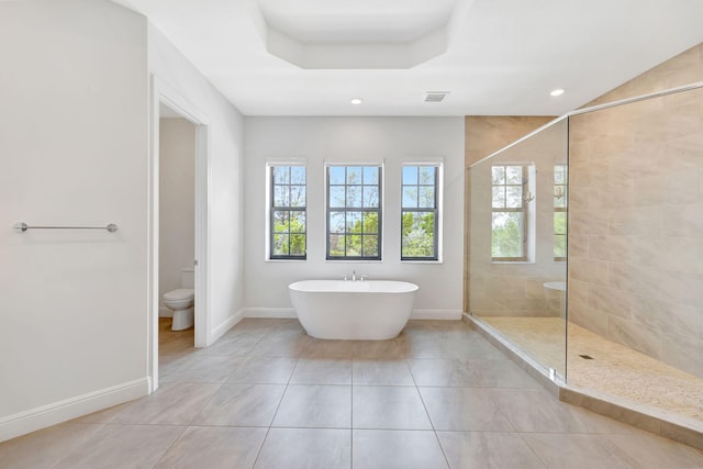 8660 W Parkland Bay Trl, Parkland, FL 33076 - bathroom with plenty of natural light, a soaking tub, a walk in shower, baseboards, and recessed lighting