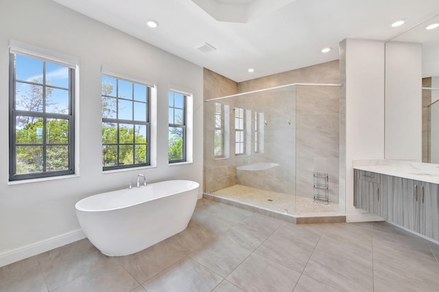 8660 W Parkland Bay Trl, Parkland, FL 33076 - bathroom featuring a soaking tub, a shower stall, baseboards, vanity, and recessed lighting